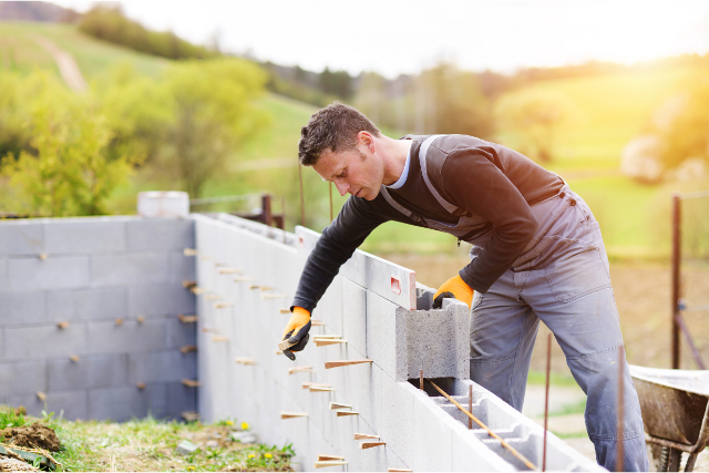 Gresham Masonry by worker with a leveler